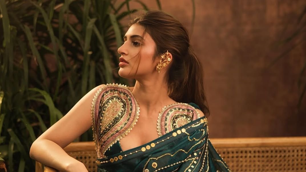Sreeleela’s emerald-green sari comes with pearl embellishments and gold sequins